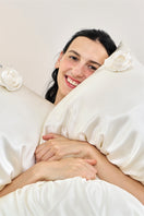 White Tuscan Rose silk pillowcase by Not Just Pajama, showcasing smooth, luxurious silk fabric and elegant design.