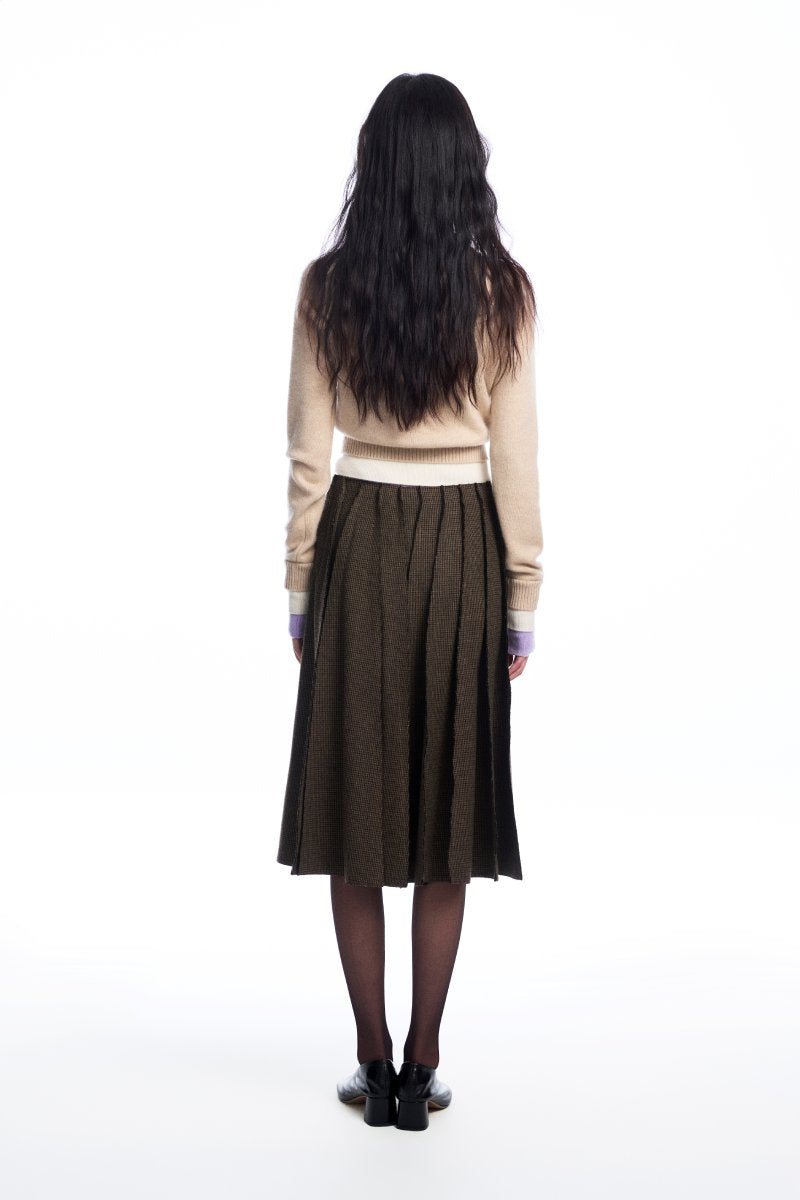 Beige layered cashmere sweater by Chictopia, featuring a soft, cozy knit with layered design and ribbed cuffs.