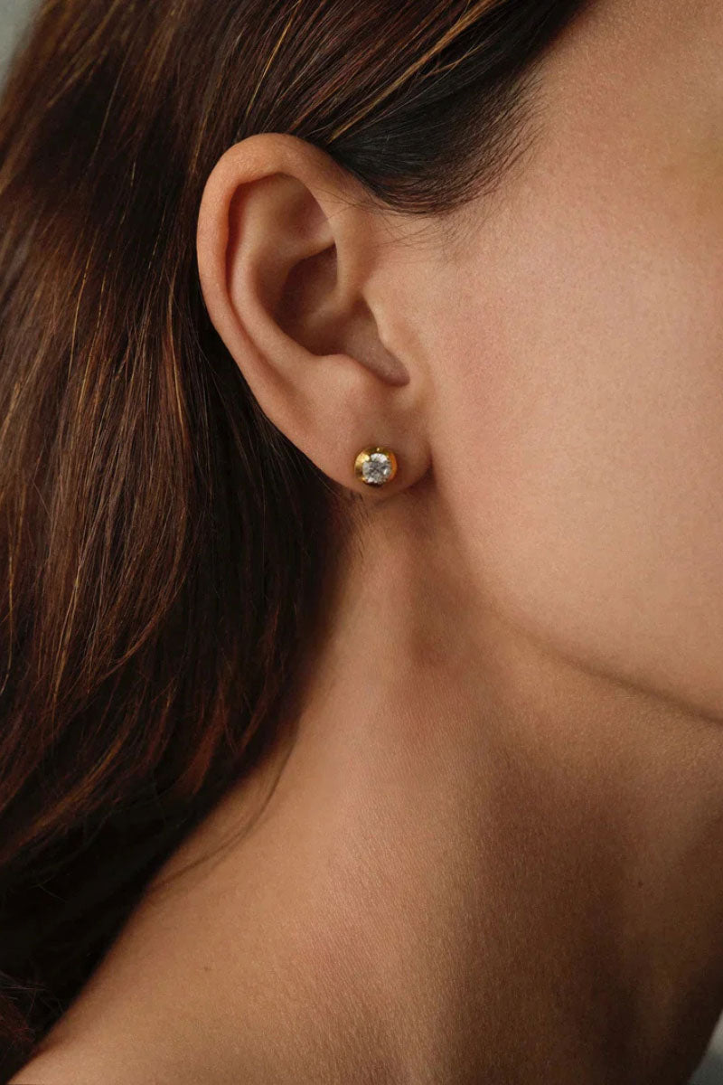 Peracas Bella stud earrings in white featuring sleek, minimalist design with small round gemstones or beads.