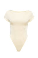 SÉLONE Aureon cut-out bodysuit in butter yellow, featuring a stylish design with cut-out details and a fitted top style.