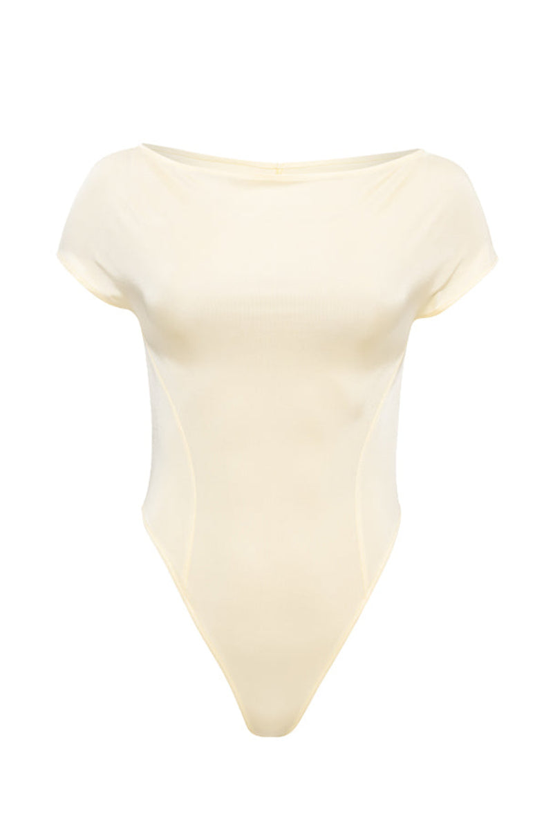 SÉLONE Aureon cut-out bodysuit in butter yellow, featuring a stylish design with cut-out details and a fitted top style.