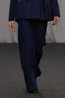 Lili Blanc tailored straight-leg denim trousers, front view showing classic blue jeans with a sleek fit and clean stitching.