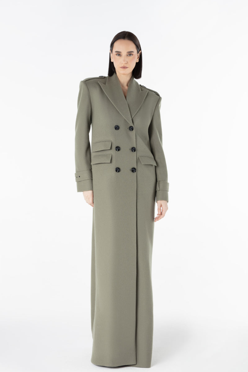 Lili Blanc Luxe Coat displayed on a hanger, showcasing its elegant design and tailored fit in a neutral color.
