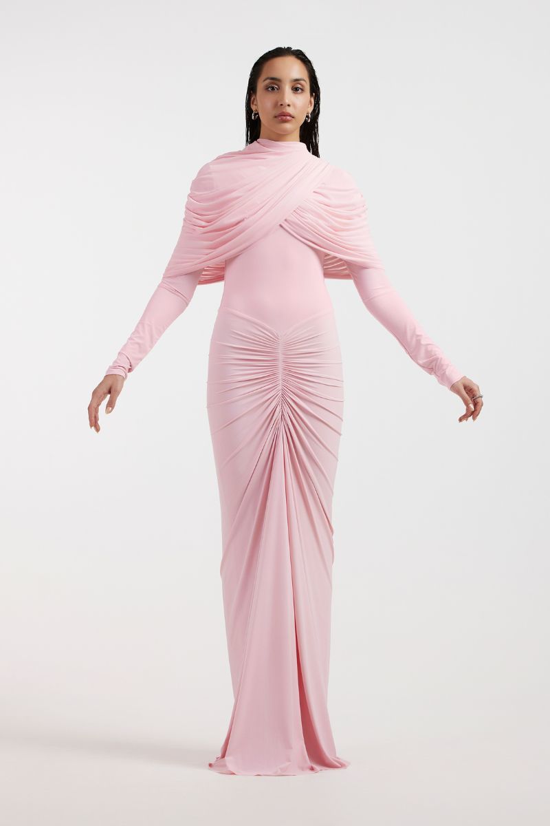 Deme By Gabriella NOA draped pink gown with flowing fabric and elegant design, showcased on a model.