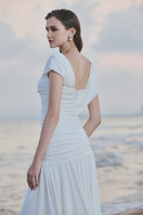 Le Thanh Hoa white scoop neck midi dress with a fitted silhouette, perfect for elegant daytime or evening wear.