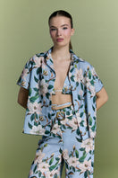 Nur Karaata Tropic Twist co-ord set featuring a matching top and pants with a tropical print, styled on a model.