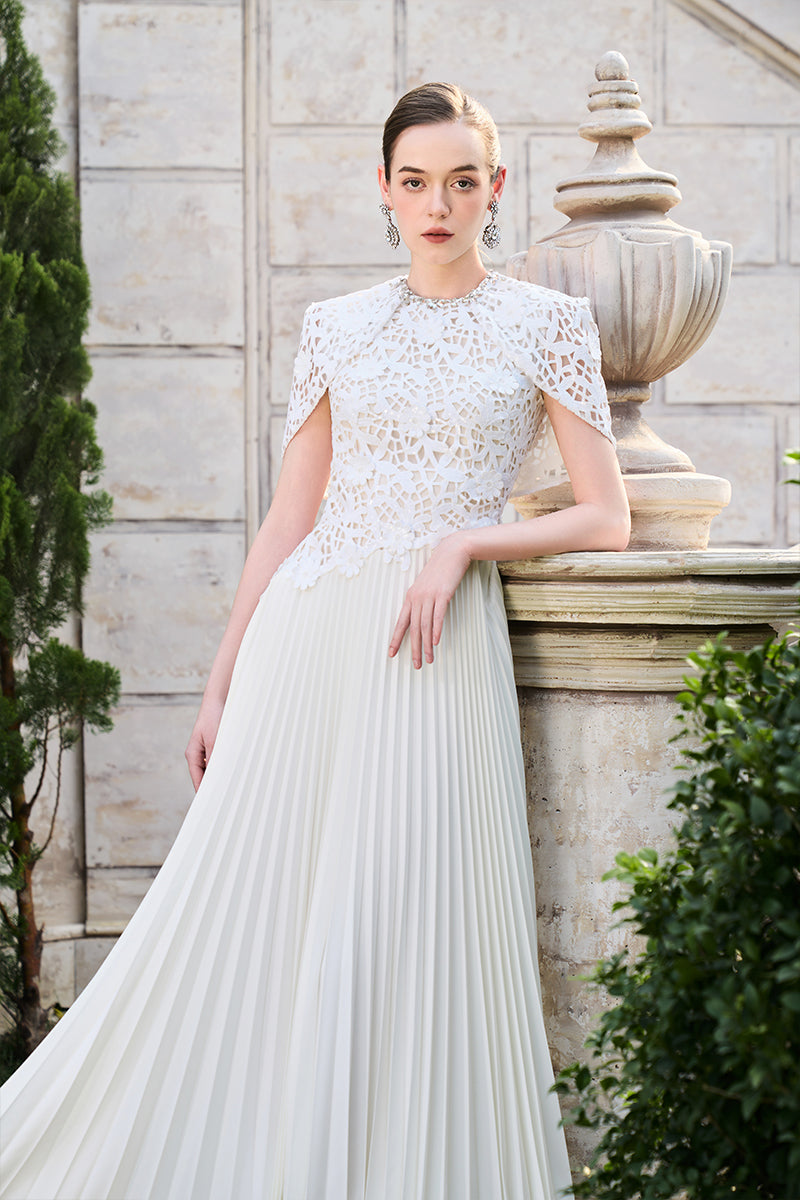 Elegant grain weave gown by Tracy Studio featuring a flowing silhouette and textured fabric, perfect for sophisticated occasions.