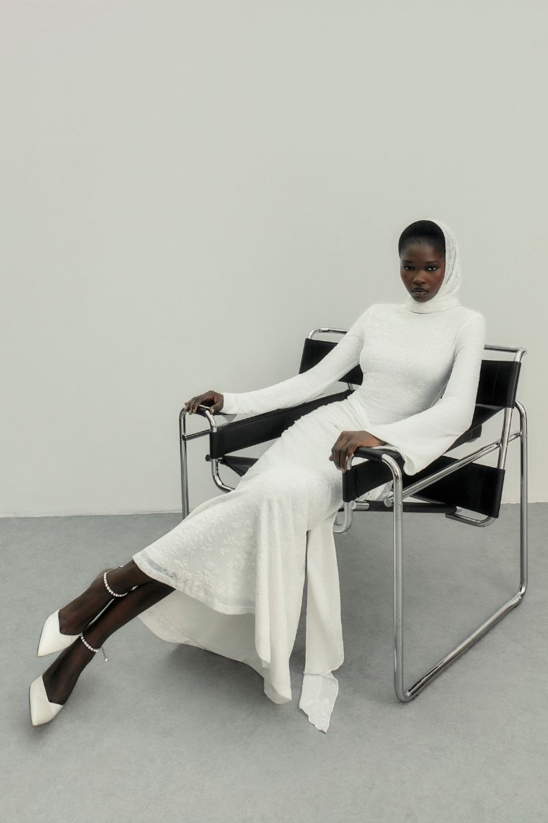 Khanum's KELI white maxi dress featuring flowing fabric and elegant design, perfect for summer or formal occasions.