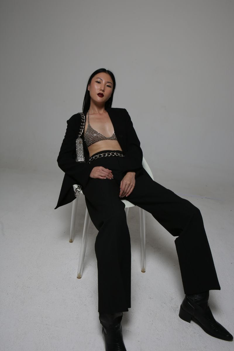 Silvia Gnecchi Chain Bra tops with metallic chain detailing and sleek design, worn as a stylish layered top or statement piece.