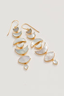 Gold moon drop earrings by Freya Rose featuring elegant, crescent-shaped design with intricate detailing.
