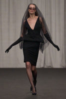 Lili Blanc sleeveless tailored midi dress with a sophisticated fit, shown on a model with neutral background.