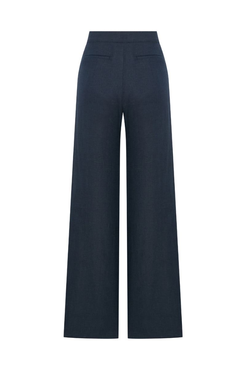 Nazlı Ceren Millie linen trousers in dark navy, featuring a relaxed fit and lightweight fabric, shown on a model.