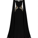 Elegant black velvet satin cape sleeve gown by Tracy Studio, featuring flowing fabric and sophisticated design.