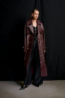 Acaria Studio Journey Leather Trench Coat in Cherry, featuring a stylish leather design and classic trench silhouette.