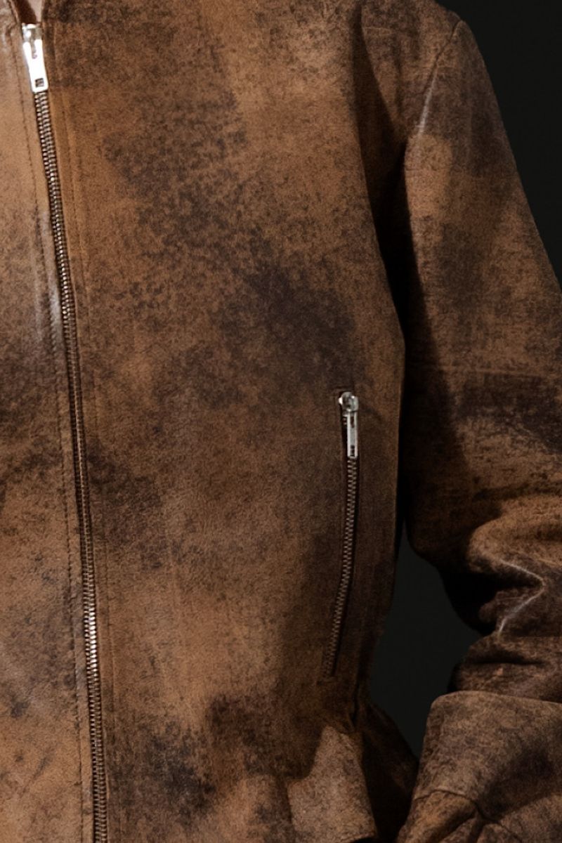 Double A Bennett leather jacket in washed brown with a classic fit, showing detailed stitching and collar in a close-up shot.