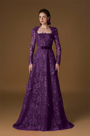 Purple V-neck A-line lace gown with long sleeves by I.H.F, featuring intricate lace details and a flowing silhouette.