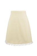 Chictopia Bonnie mini skirt in pastel yellow, lightweight fabric, high waist design, shown on a model.