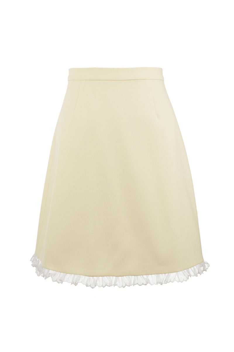 Chictopia Bonnie mini skirt in pastel yellow, lightweight fabric, high waist design, shown on a model.