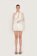 Elegant embroidered feather cape jacket by Monika Dimova with intricate feather and floral embroidery details.