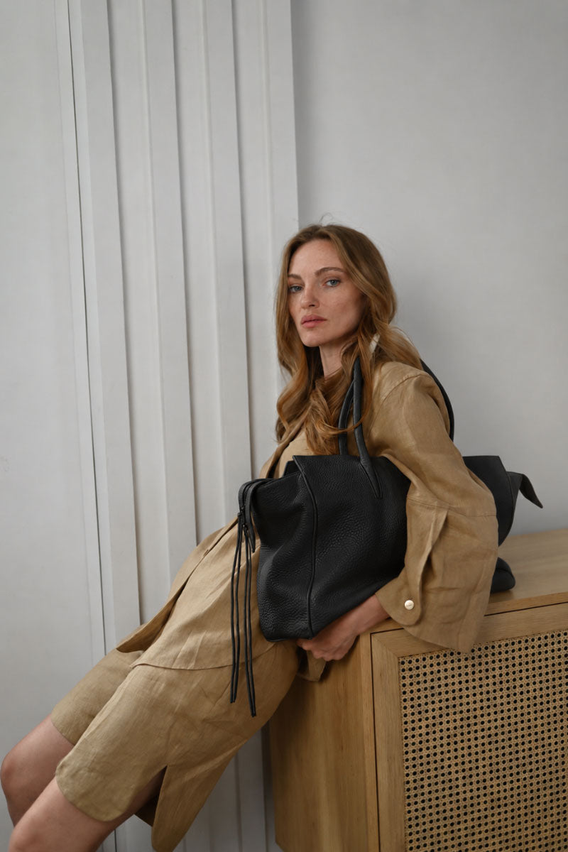 Black VIKELE STUDIO shoulder tote bag with sturdy handles and spacious interior, ideal for daily use and casual outings.