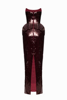 Elegant burgundy gown from the MUNA DRESS collection by BALYKINA, shown with flowing fabric and intricate design details.