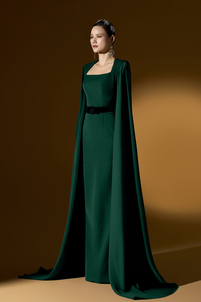 I.H.F mica crepe cape gown featuring a flowing, elegant design with long sleeves and a sophisticated silhouette.