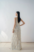 Beige deep V-neck tiered pleated maxi dress by DOC BAN, flowing fabric with layered pleats and a relaxed fit.