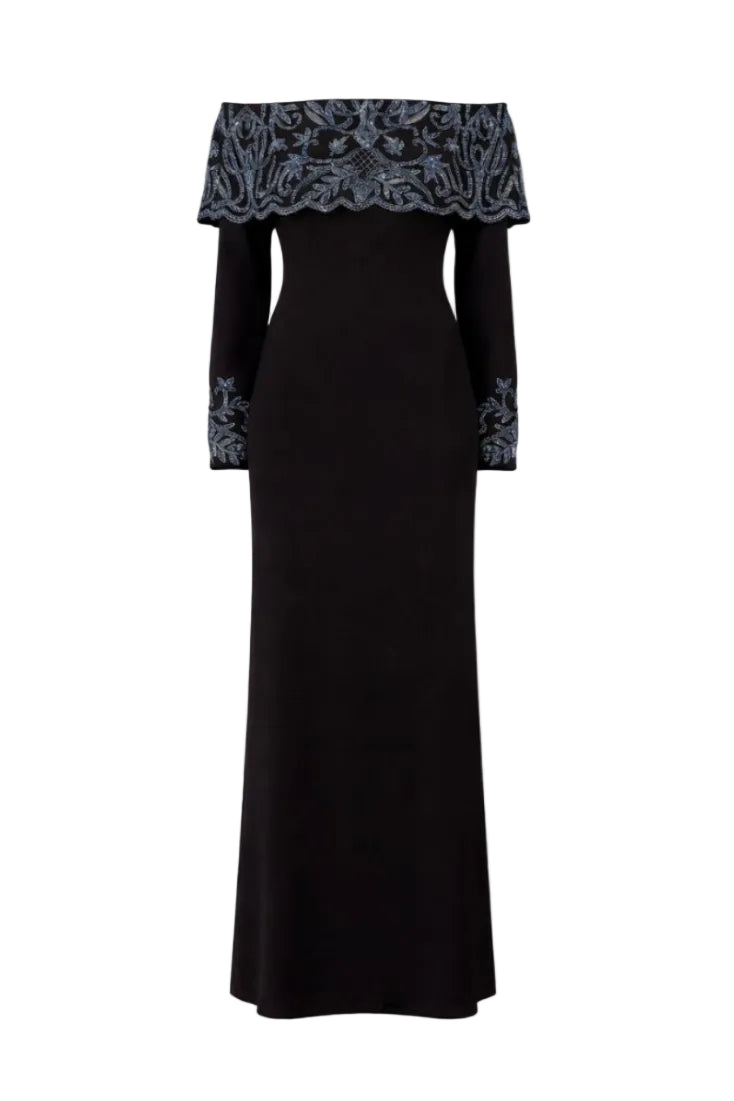 Elegant black gown by Raishma with intricate detailing, designed by Maria Black, shown on a mannequin.