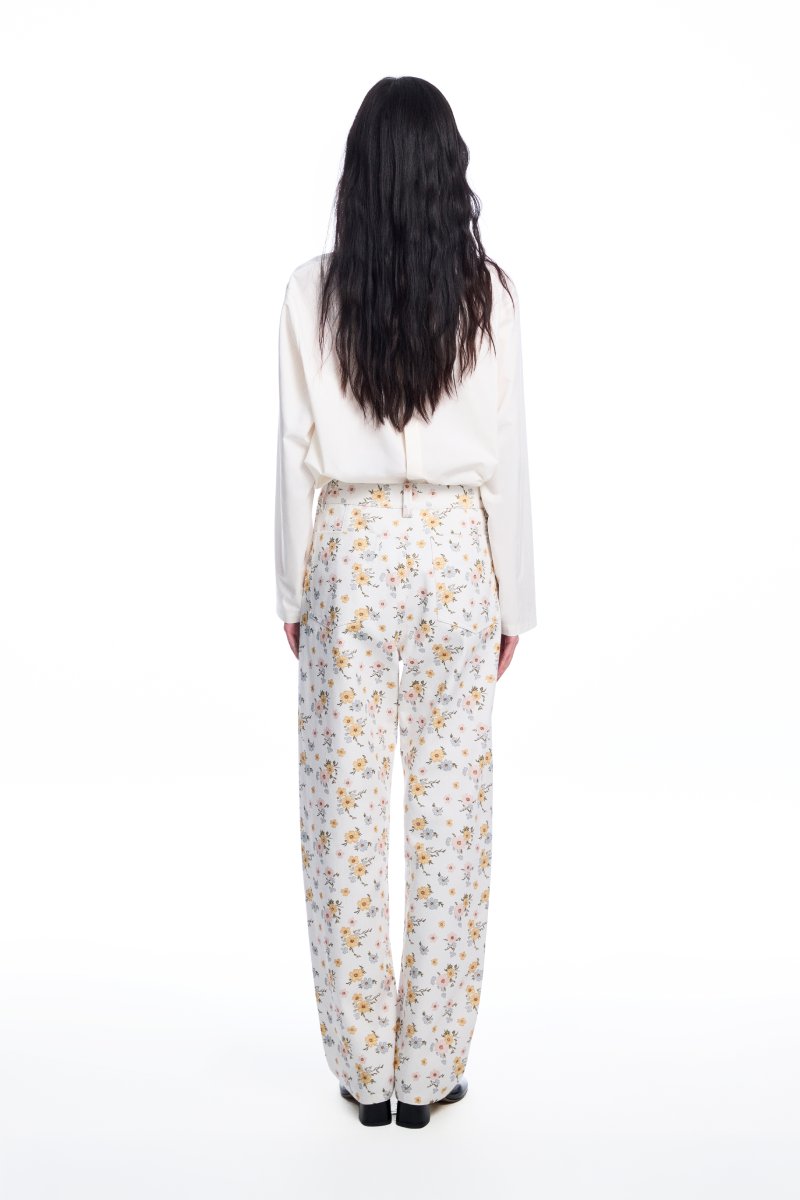 Chictopia floral jeans with colorful floral print, slim fit denim showcasing vibrant patterns and stylish design.