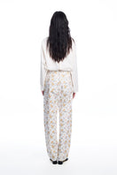 Chictopia floral jeans with colorful floral print, slim fit denim showcasing vibrant patterns and stylish design.