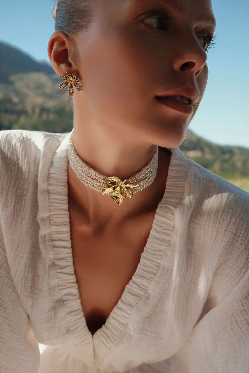 Peracas Paola ivory choker necklace featuring a sleek, minimalist design on a neutral background.