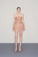 CEM strapless blush-toned mini dress with embellishments, fitted bodice, and flared skirt for elegant evening wear.
