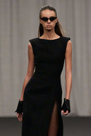 Lili Blanc modern sleeveless midi dress with a sleek, minimalist design, featuring a fitted bodice and flowing skirt.