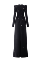 Black stone-embellished long-sleeve gown by Tracy Studio, featuring elegant detailing and a flowing silhouette.