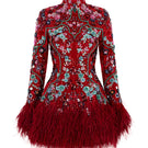 Le Thanh Hoa Ruby Blossom Dress, a vibrant red mini dress with floral details, displayed on a hanger against a neutral background.