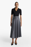 Long black maxi skirt from Acaria Studio's Wisdom Skirt collection, flowing fabric and elegant design.