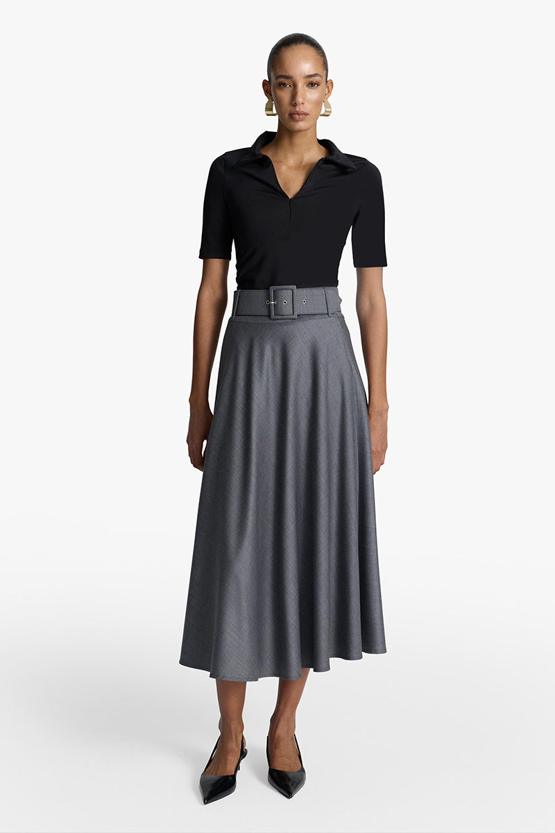Long black maxi skirt from Acaria Studio's Wisdom Skirt collection, flowing fabric and elegant design.