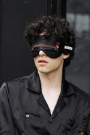 White silk sleeping eye mask featuring a dachshund design from Not Just Pajama, perfect for restful sleep.