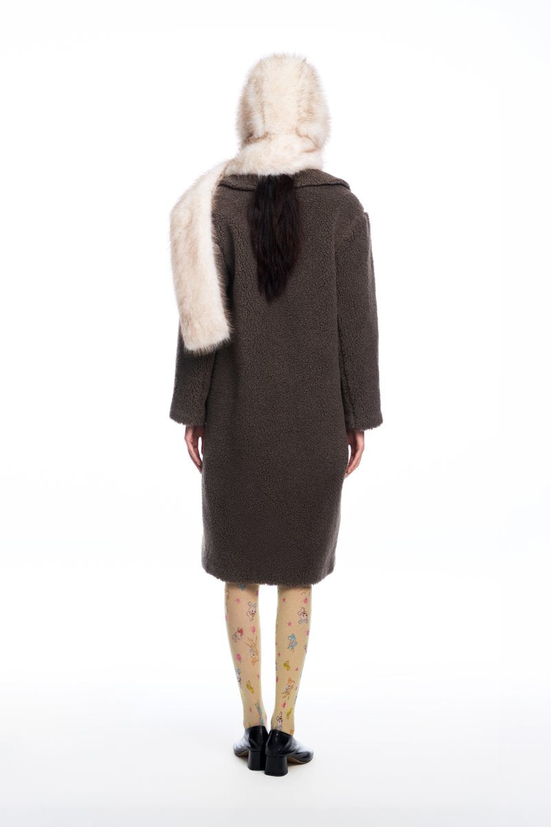 Chictopia faux fur hood scarf showing soft, plush fur with attached hood, ideal for winter warmth and stylish cold weather accessories.