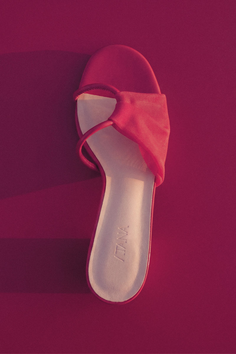 Pair of House of Atana GIRO HEEL ROSSO red heels with stylish design and sleek heel, perfect for elegant occasions.