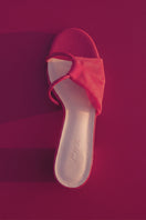 Pair of House of Atana GIRO HEEL ROSSO red heels with stylish design and sleek heel, perfect for elegant occasions.