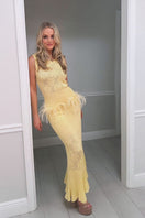 Andreeva knit maxi dress with feather details, flowing silhouette and elegant design, perfect for stylish occasions.
