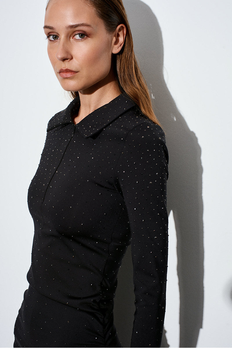 Black Acaria Studio scuba dress with rhinestones, featuring a sleek maxi dress design with sparkling embellishments.