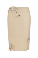 Cream Belle lace knee-length midi skirt by Stolen Stores, featuring intricate lace details and a flattering fit.