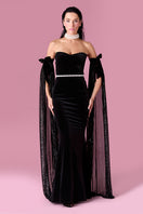Nur Karaata Daisy Gown displayed on a model, featuring a flowing fabric and elegant design perfect for formal occasions.