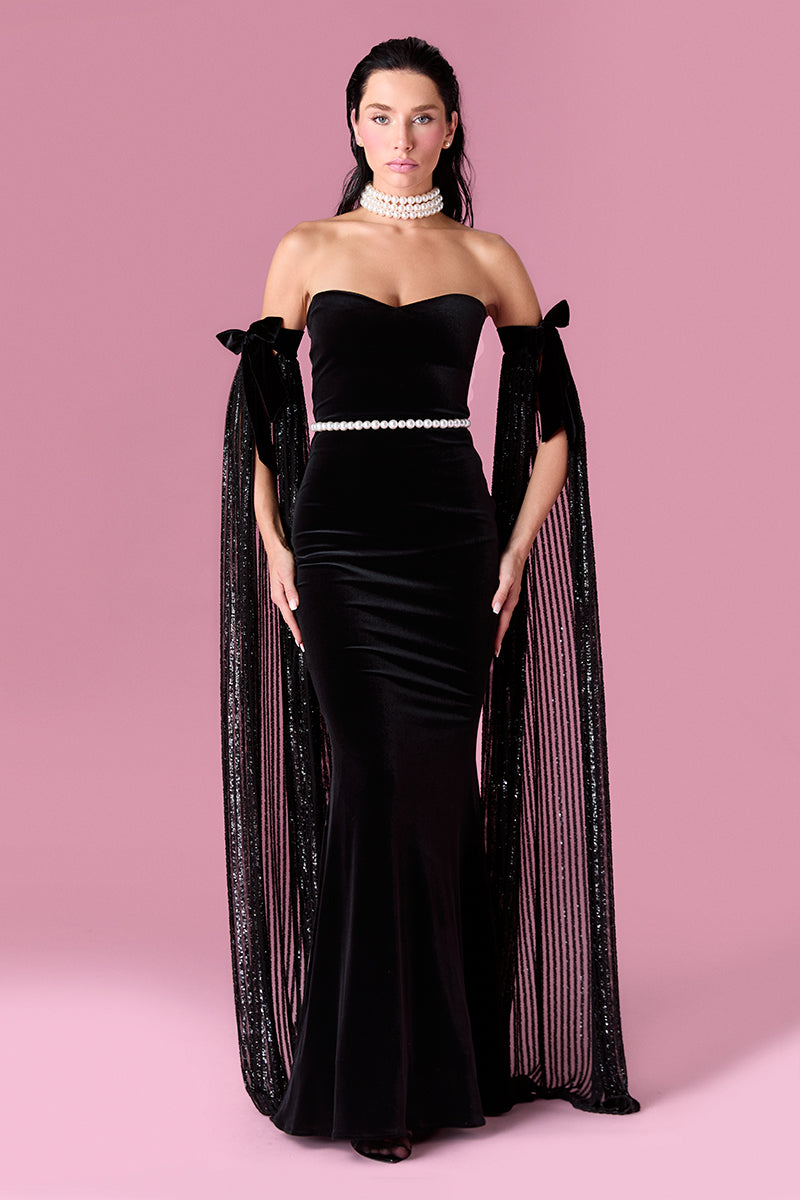 Nur Karaata Daisy Gown displayed on a model, featuring a flowing fabric and elegant design perfect for formal occasions.
