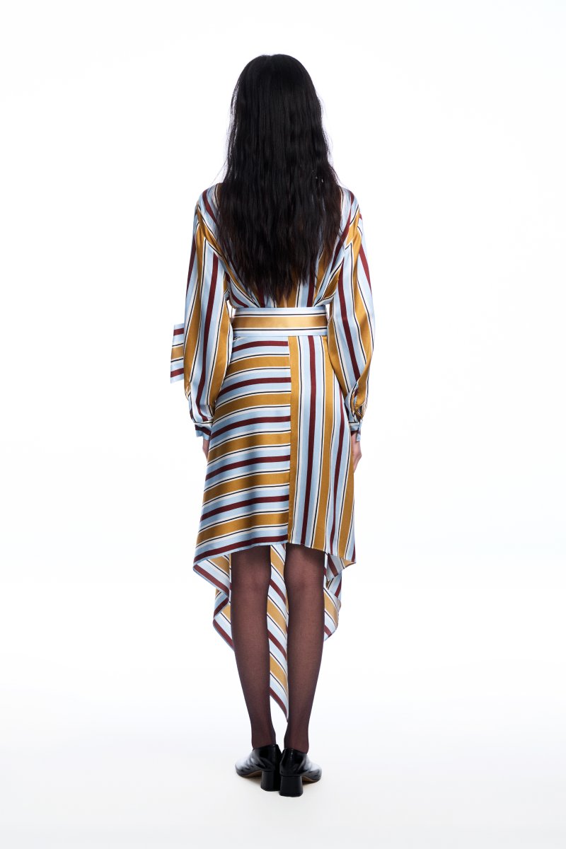 Chictopia silk belted striped midi dress hanging on a wooden hanger, showcasing its elegant design and vibrant pattern.