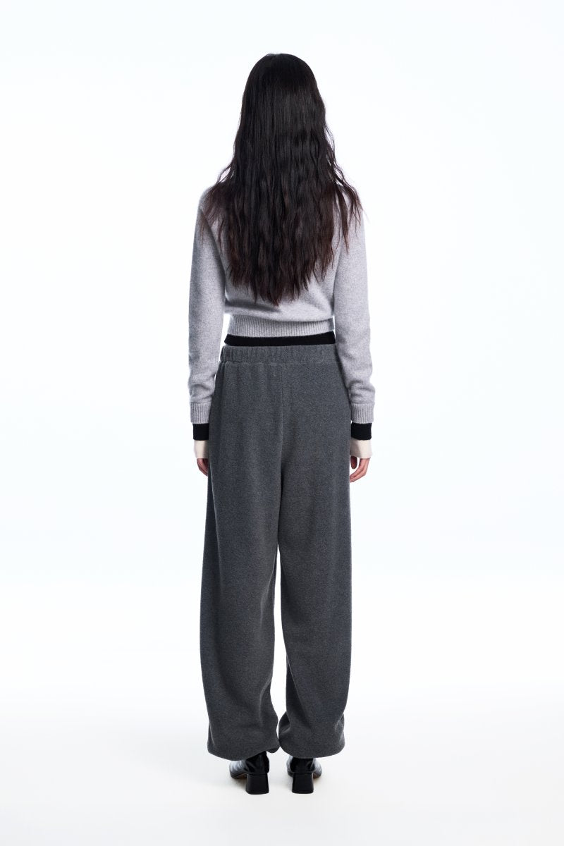 Chictopia layered grey cashmere sweater showing soft fabric, relaxed fit, and stylish layered design on a neutral background.