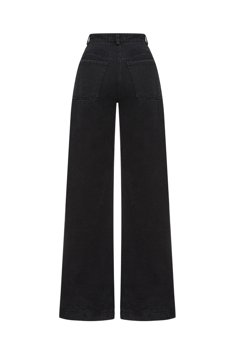 Black wide-leg jeans by ELENAREVA, shown on a model, featuring a relaxed fit and classic denim style.