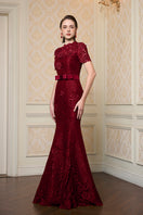 Red gown by I.H.F featuring guipure lace overlay and taffeta silk lining, elegant and flowing for formal occasions.